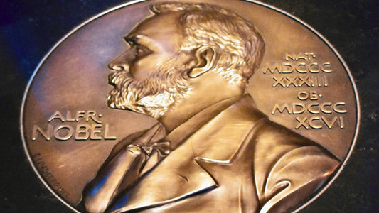 Engraved portrait of Alfred Nobel on a commemorative plate, honoring the left-handed scientists who have won his prestigious prize.