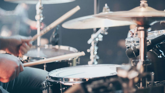 Closeup of a left-handed drummer showcasing technique.