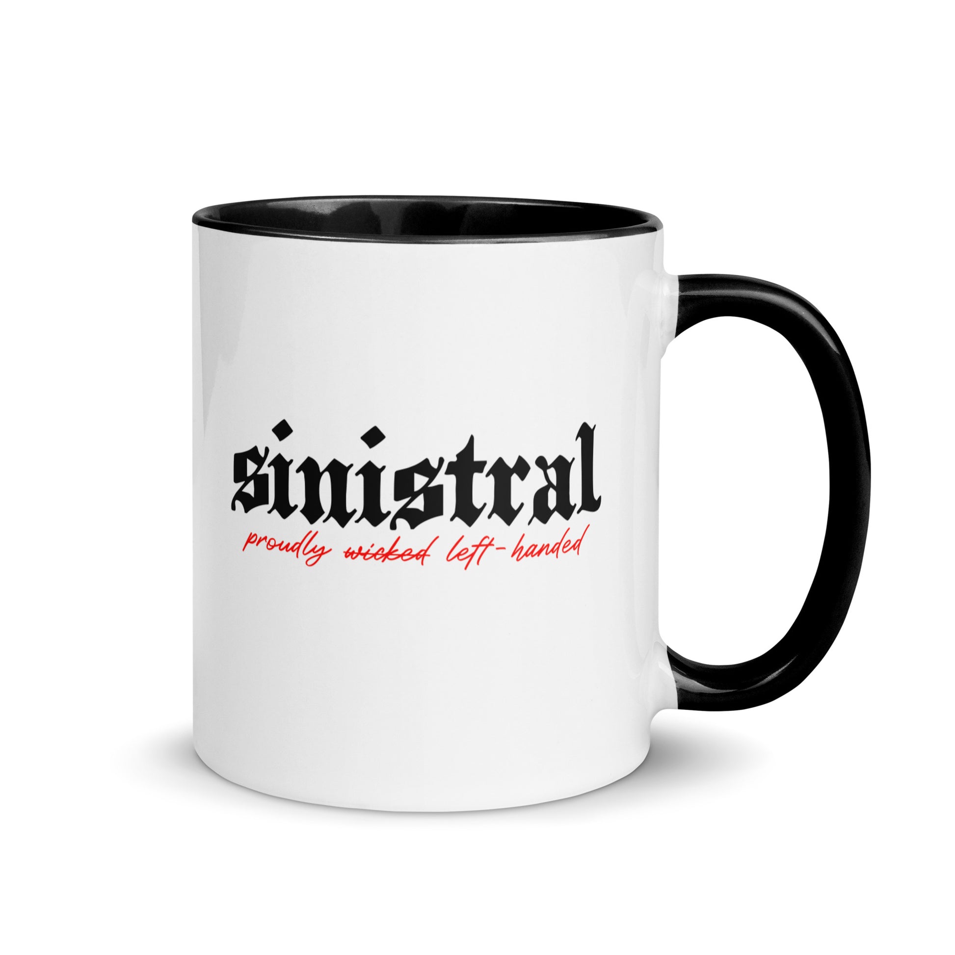 White ceramic mug for left-handers featuring black gothic text "Sinistral: Proudly Left-Handed" with black handle and interior.