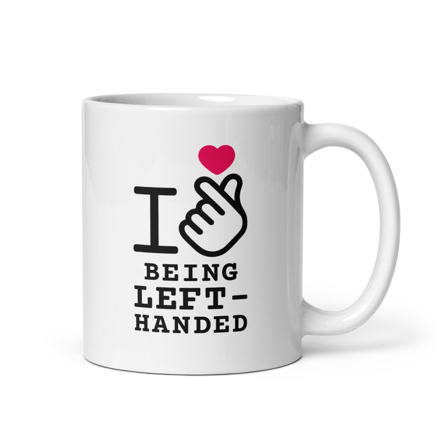 White mug with black text and a red heart on a white background