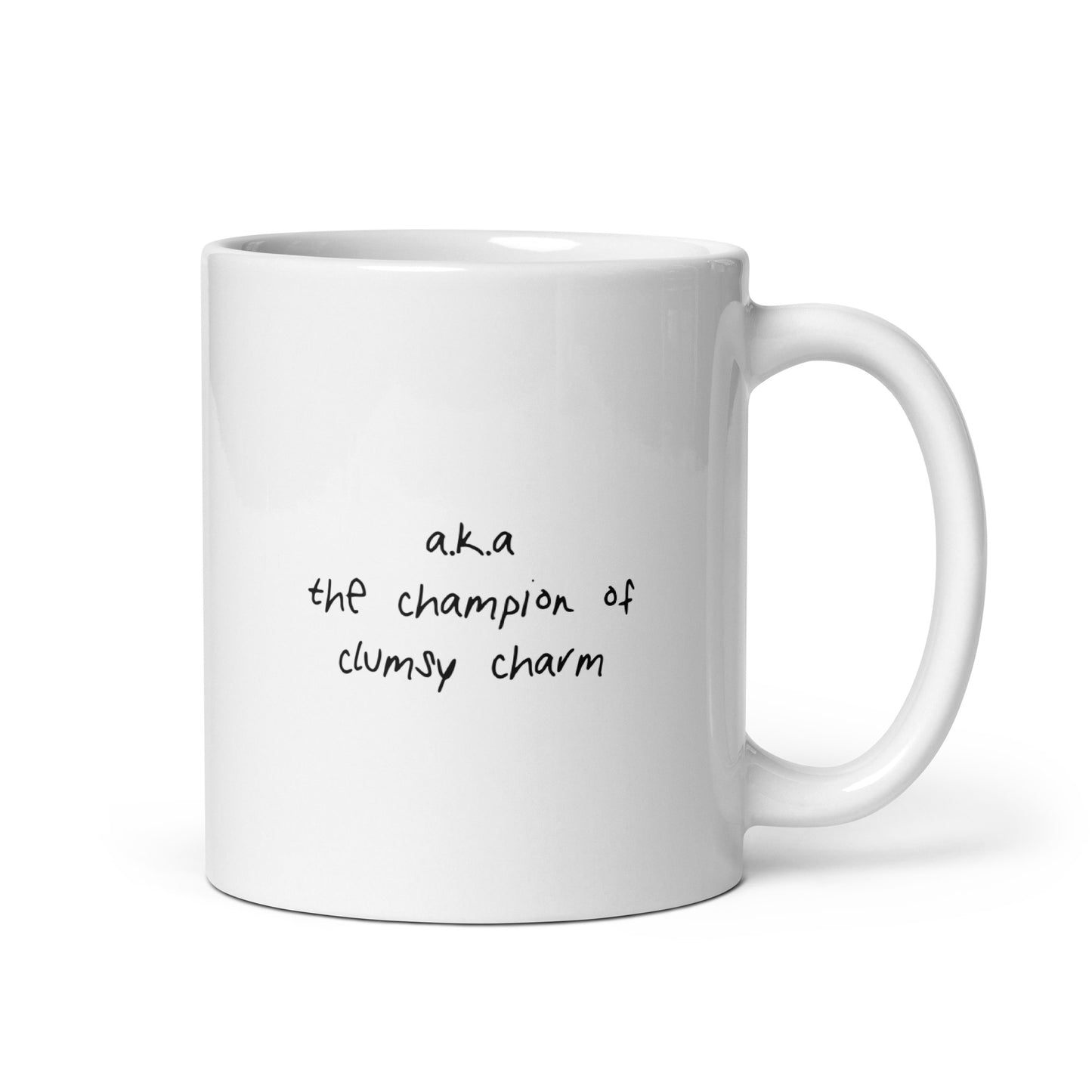 White ceramic mug for left-handers with hello i’m undexterous sticker inspired design