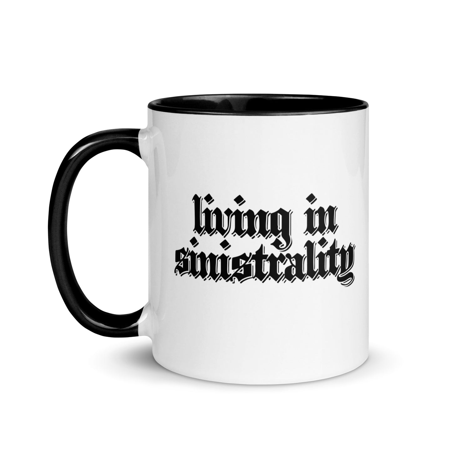 White ceramic mug for left-handers featuring black gothic text "Living in Sinistrality" with black handle and interior.