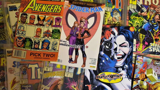 A scattered collection of comic books, highlighting the creative world shaped in part by left-handed comic book artists.