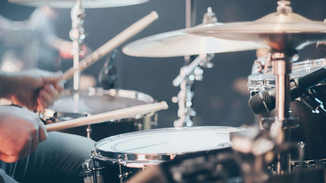 Closeup of a left-handed drummer showcasing technique.