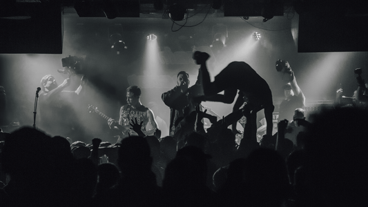 A punk rock show featuring a left-handed guitarist.