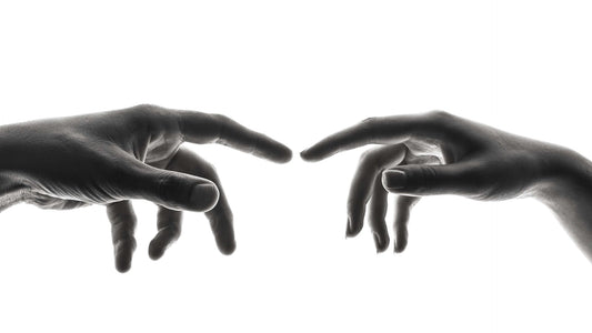 Two fingertips from opposite hands meeting, representing sinistral and dextral sides.