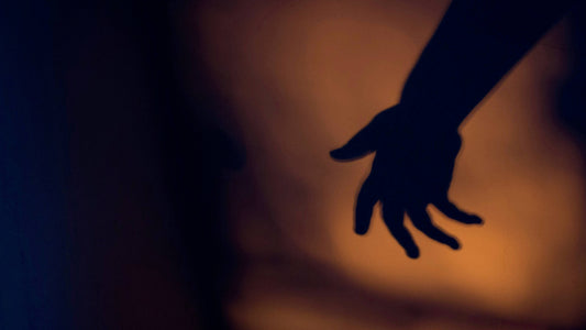 Close-up of an out-of-focus left hand, symbolizing sinistrophobia, the fear of left-handedness.