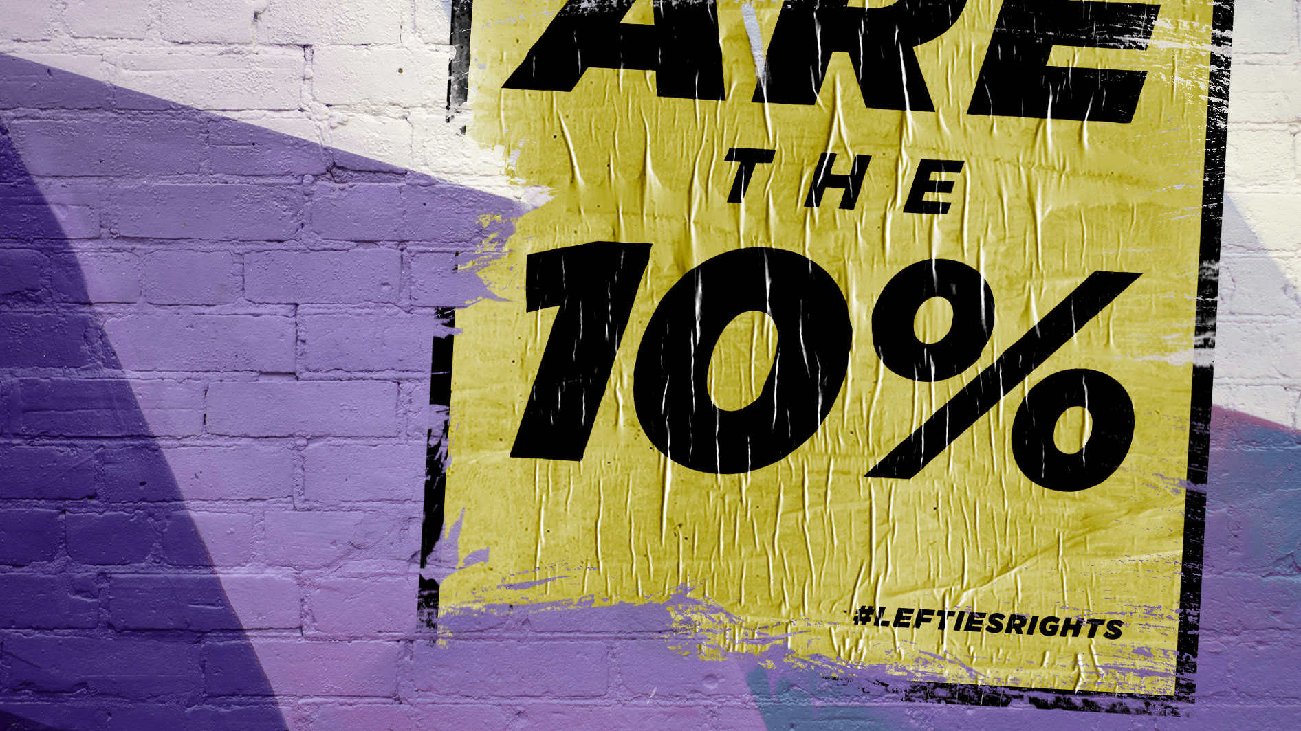 Brick wall with weathered poster featuring "We Are the 10%."