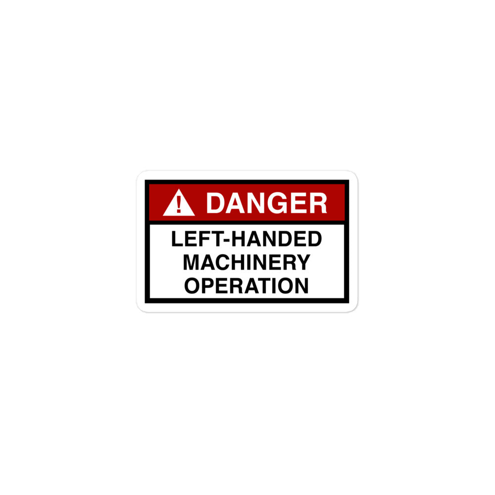 Durable vinyl sticker for left-handers featuring "Danger: Left-Handed Machinery Operation" hazard sign.