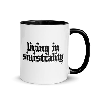 White ceramic mug for left-handers featuring black gothic text "Living in Sinistrality" with black handle and interior. mockup