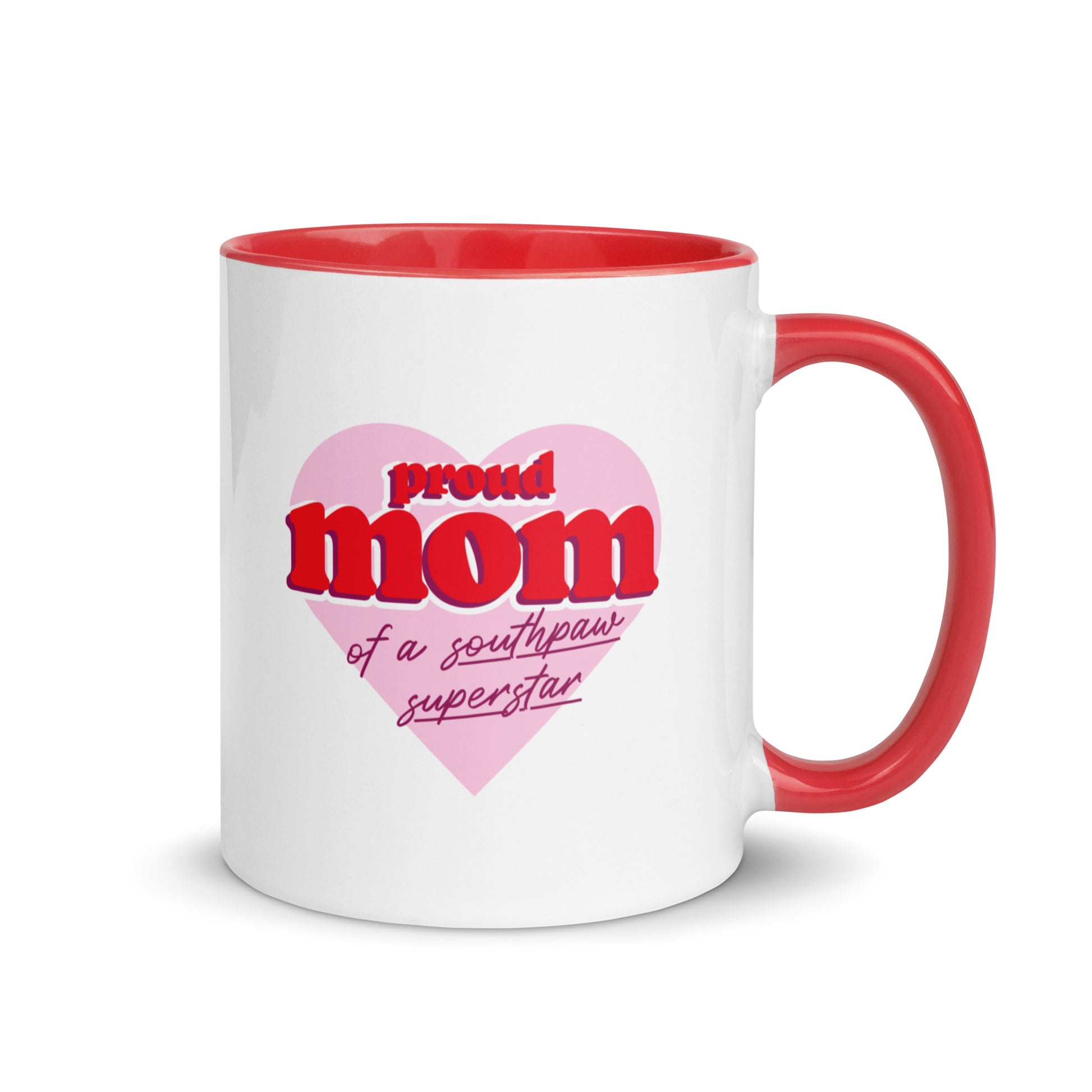 White ceramic mug for left-handers’ moms featuring the statement "Proud Mom of a Southpaw Superstar" in bold graphic text with red handle and interior.