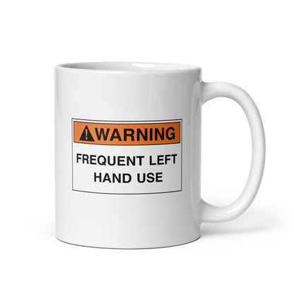 White ceramic mug for left-handers with a warning frequent left hand use hazard sign design