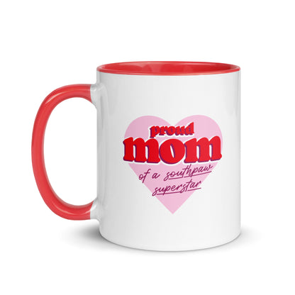 White ceramic mug for left-handers’ moms featuring the statement "Proud Mom of a Southpaw Superstar" in bold graphic text with red handle and interior.