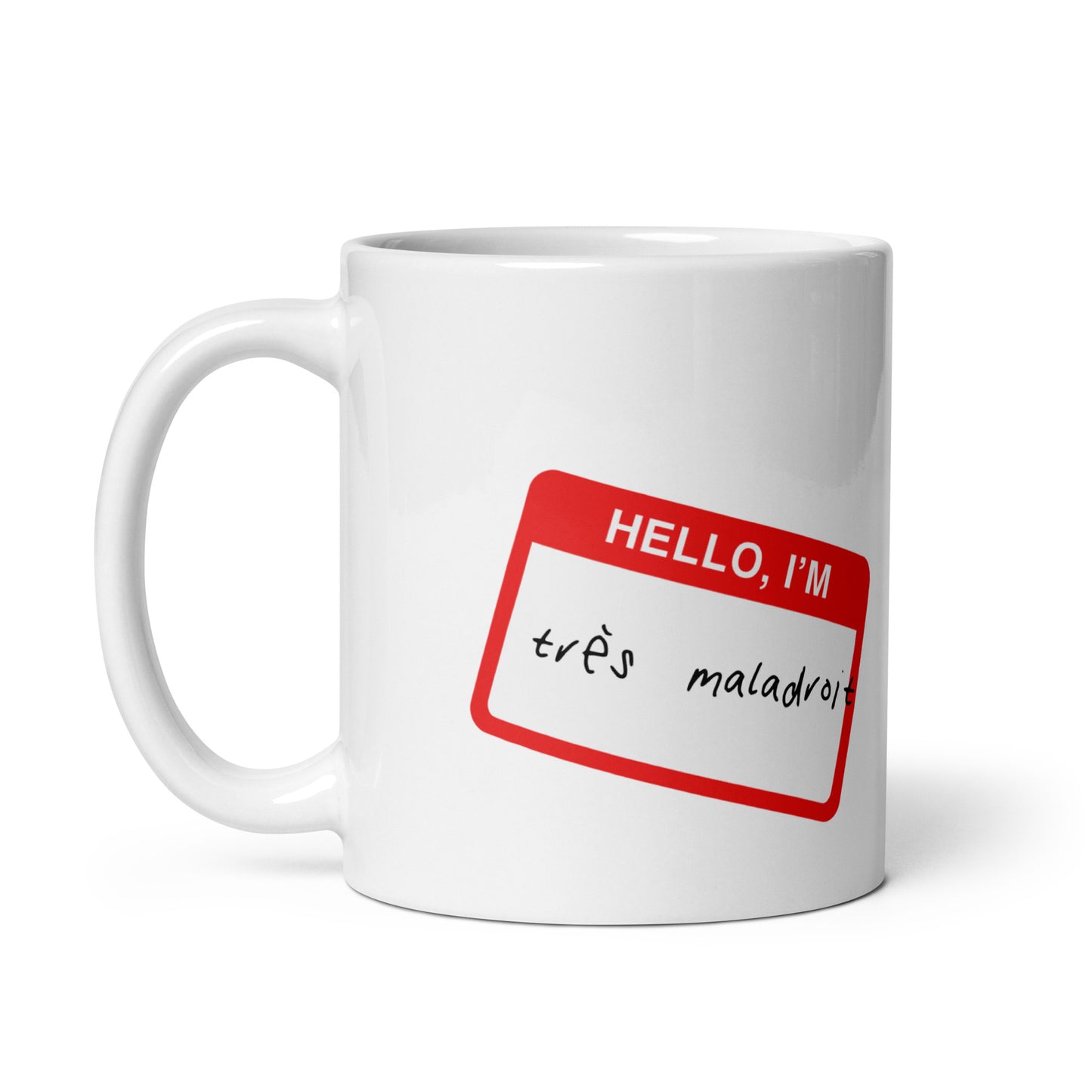 White ceramic mug for left-handers with hello i’m tres maladroit sticker inspired design