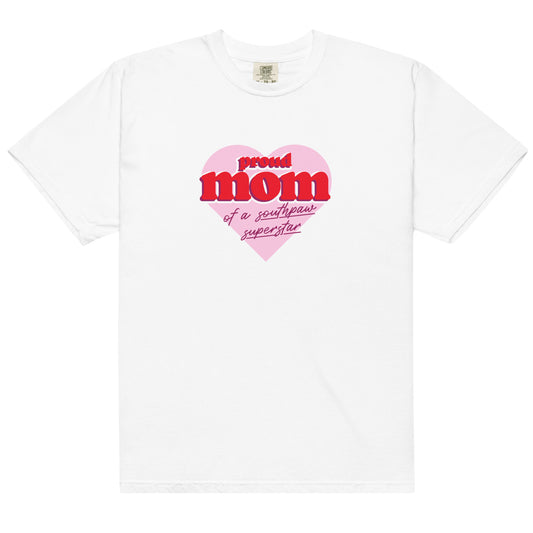 White cotton t-shirt for moms of left-handers featuring the statement "Proud Mom of Southpaw Superstar" in bold graphic text.